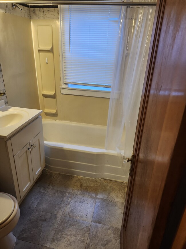 New tiled floor in bathroom - 4249 Hohman Ave