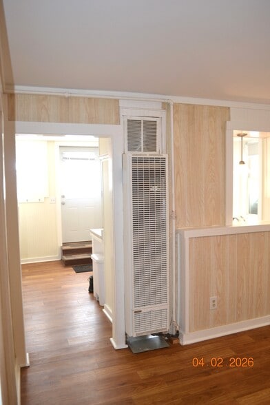 the updated flooring runs from kitchen/dining into living room - 222 W Case St