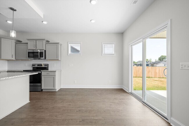 Building Photo - Pet Friendly Three Bedroom with Bonus!