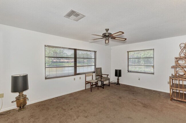 Building Photo - BEAUTIFUL 2 BEDROOM 2 BATHROOM + A DEN VILLA WITH GORGEOUS LAKE VIEWS!