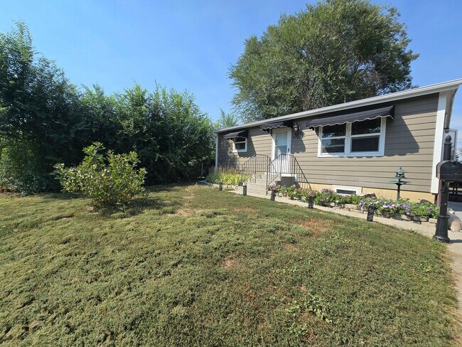 Primary Photo - Spacious 4 Bedroom Home with Fenced Yard +...