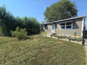 Building Photo - Spacious 4 Bedroom Home with Fenced Yard + Pet Friendly! NOT FURNISHED