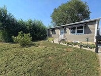 Building Photo - Spacious 4 Bedroom Home with Fenced Yard + Pet Friendly! NOT FURNISHED