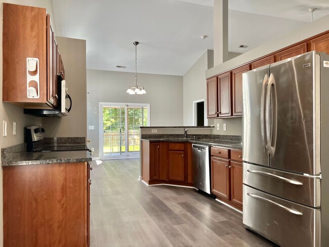 Building Photo - Spacious 3 BR House w/ Fenced Backyard and...