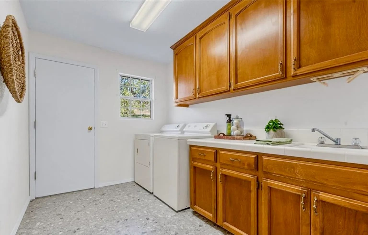 Oversized Laundry Room with utility sink and additional storage (note: electric dryer). - 221 Appy Way