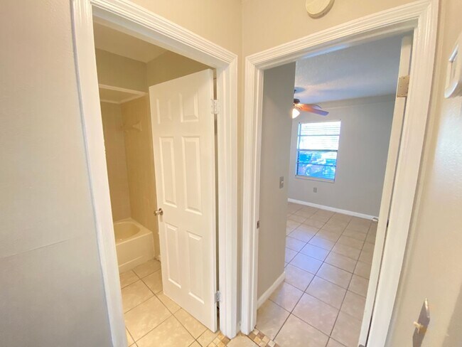 Building Photo - 2/2 home with garage - tile on inside with...