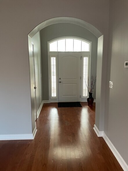view of front entrance from living room - 824 Wintercreeper Dr