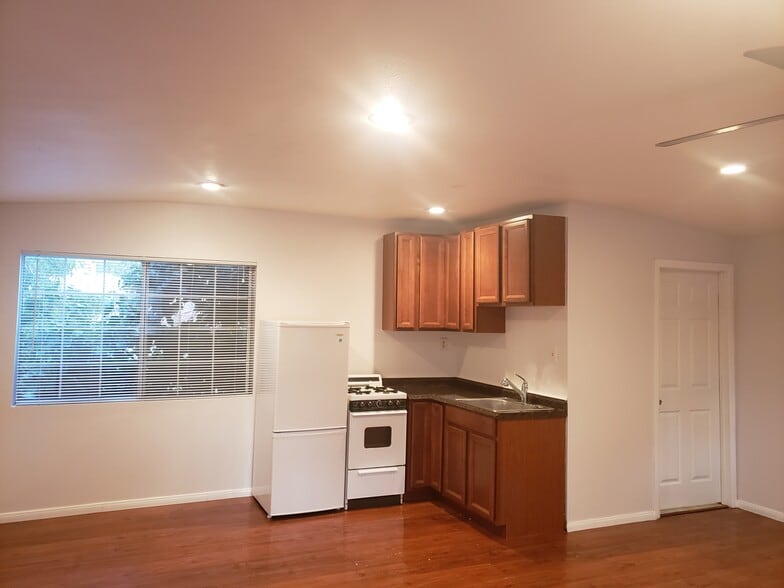 Kitchen view with stove setup. - 4966 Twining St