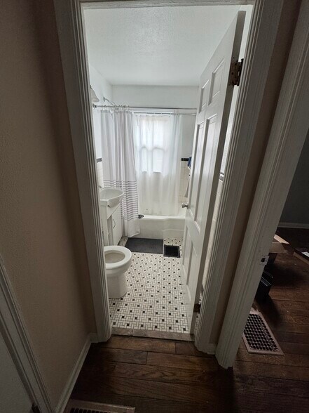 Bathroom on main level. - 3806 Byram Ave