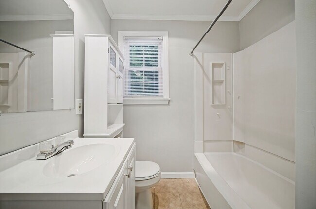 Building Photo - RARE FIND-4 BEDROOMS, 2 BATHROOMS, FENCED BACK YARD and GARAGE-PETS!!
