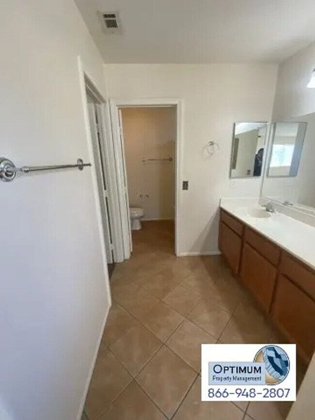 Building Photo - Spacious 4-Bedroom Home with 3-Car Garage & Downstairs Suite!