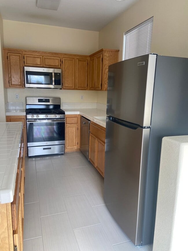 Building Photo - 4 Bedrooms, 2 Bathrooms, 3 Car Garage, 1899 sq. ft., Large Fenced, Front Yard Lawn, Near Schools ...