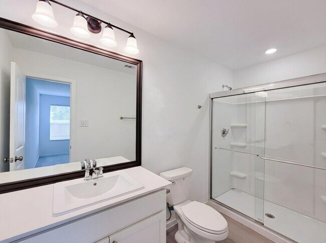 Building Photo - This single-level home showcases a spacious open floorplan shared between the kitchen, dining are...