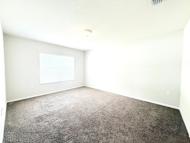 Building Photo - Spacious 4BR Home with Large Fenced Yard & Community Pool