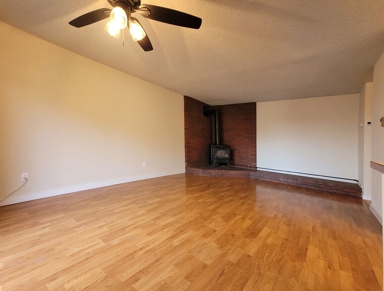 Living room with woodstove - 649 N Hayes St