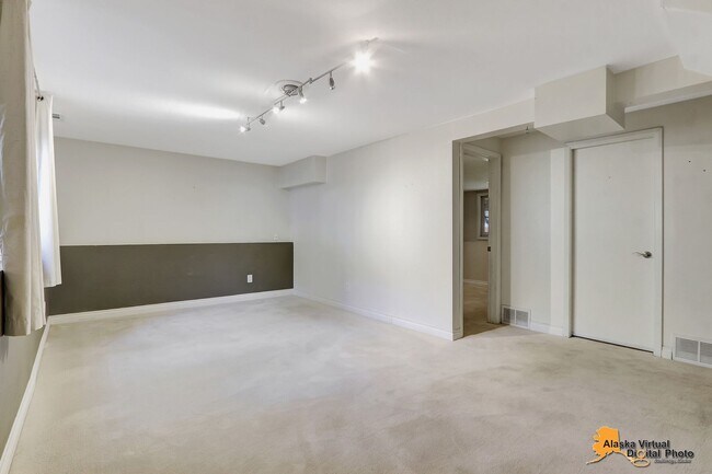 Building Photo - Eagle River Home w/ Fenced Yard, Sunroom, and Garage!