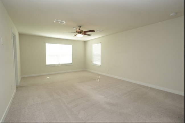 Building Photo - This wonderful home has a covered rocking chair front porch