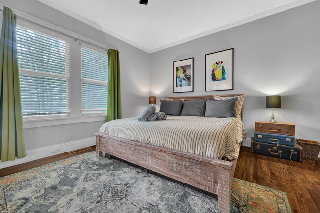 Master bedroom features a King-sized bed - 1876 DeKalb Ave NE