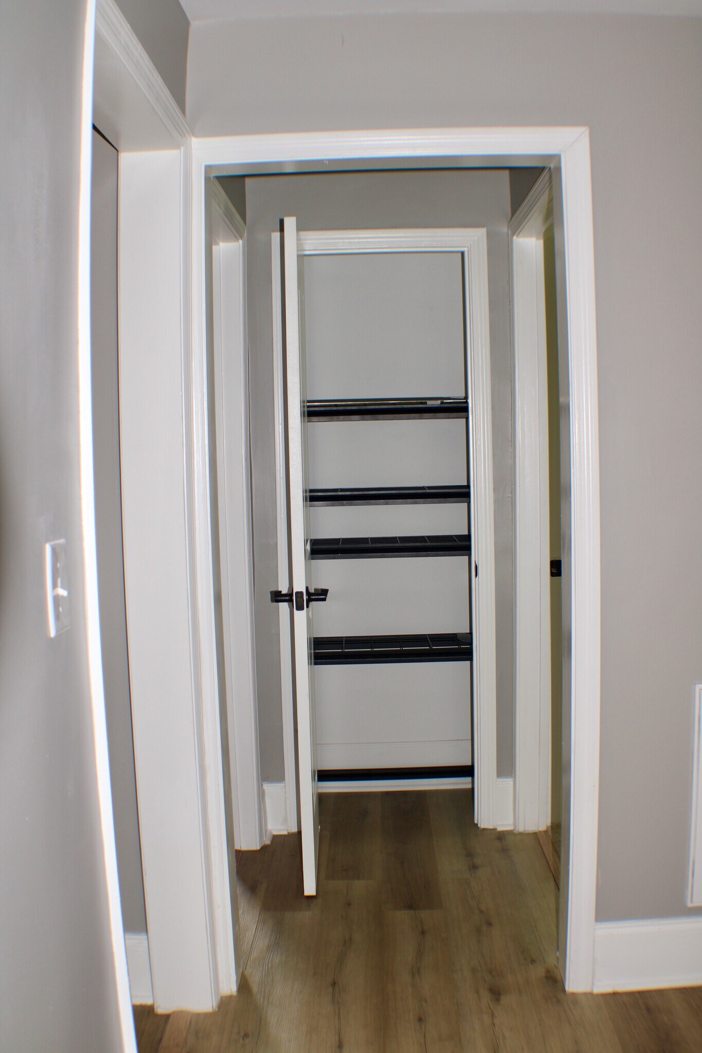 Hallway from kitchen to the storage closet, hall bathroom, and two bedrooms - 311 Paris Mountain Ave