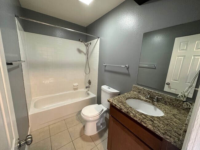 Experience relaxation in this modern bathroom, combining elegance and functionality. - Williams Street