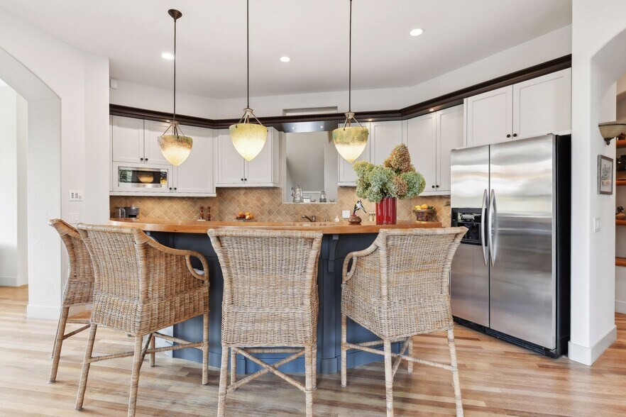 Beautiful Chef's kitchen with stainless steel appliances, large center island, and plenty of counter - 745 Rice St E
