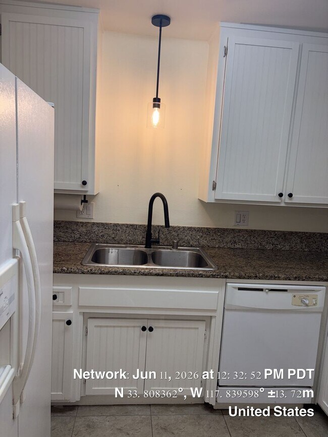 Building Photo - Two bed 1.5 bath townhome available now.