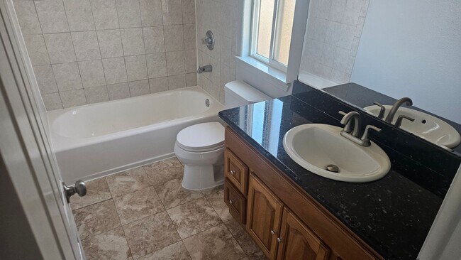 Building Photo - Three Bedroom Two and a half bath house, 2 car garage, central air. Available now.