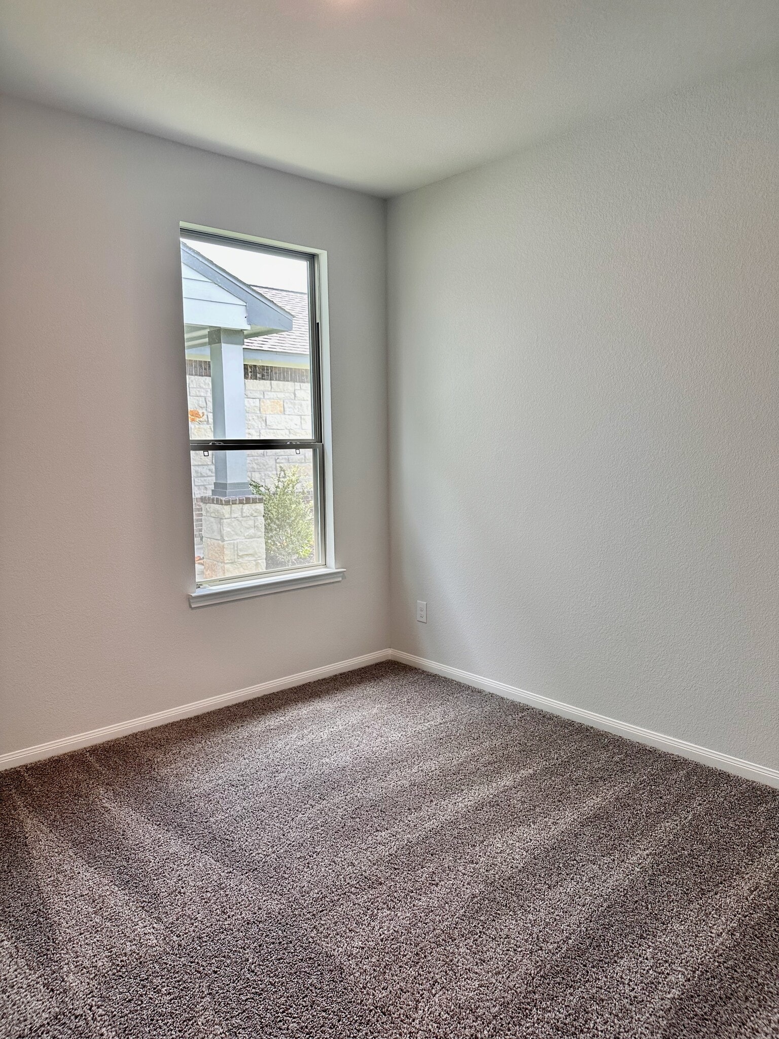 The first secondary bedroom is downstairs, spacious and features carpet! - 730 Tejas Village Pky