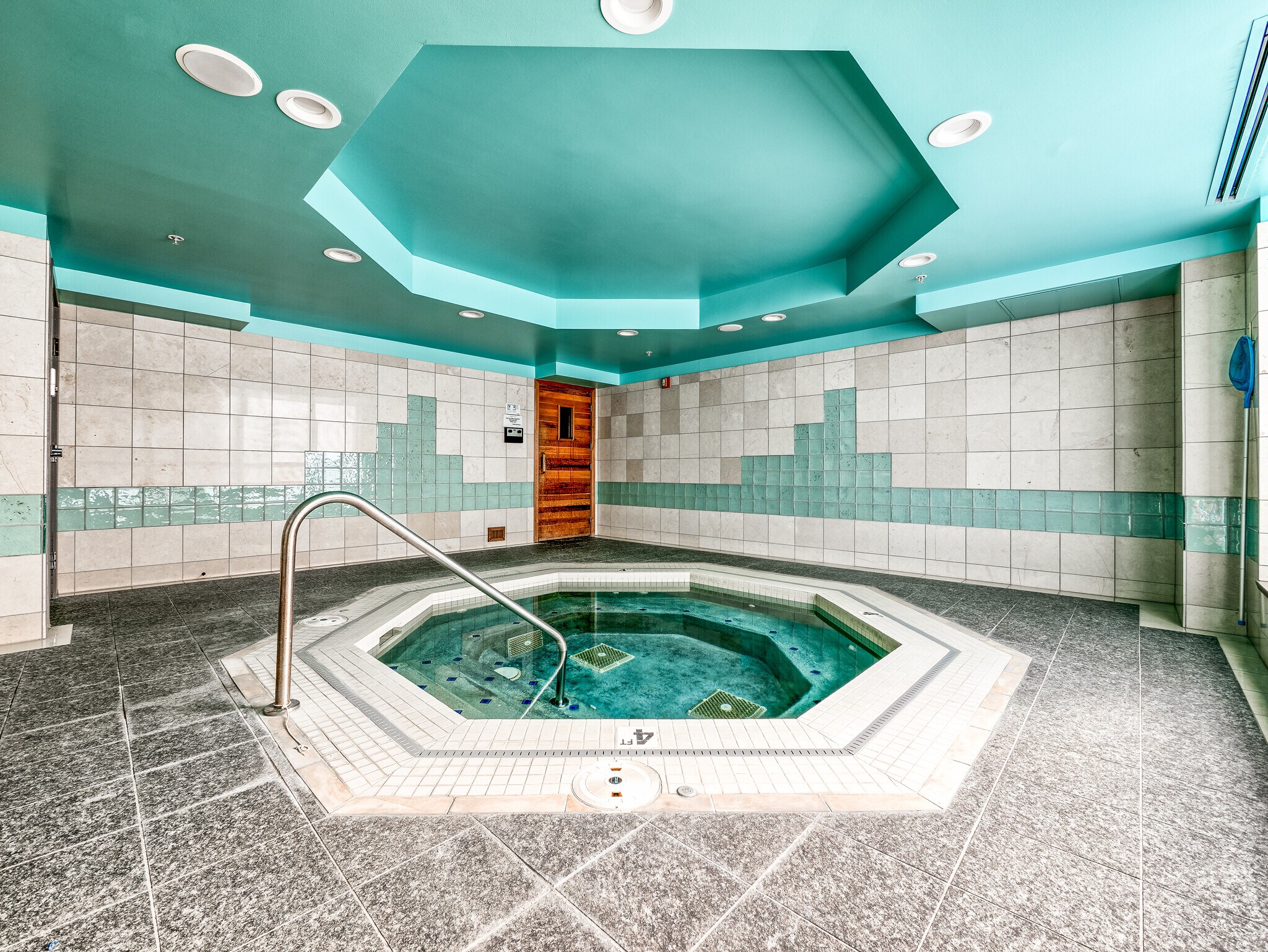 Enjoy serene evenings in the building’s private bubbling hot tub and indoor spa - 2929 1st Ave