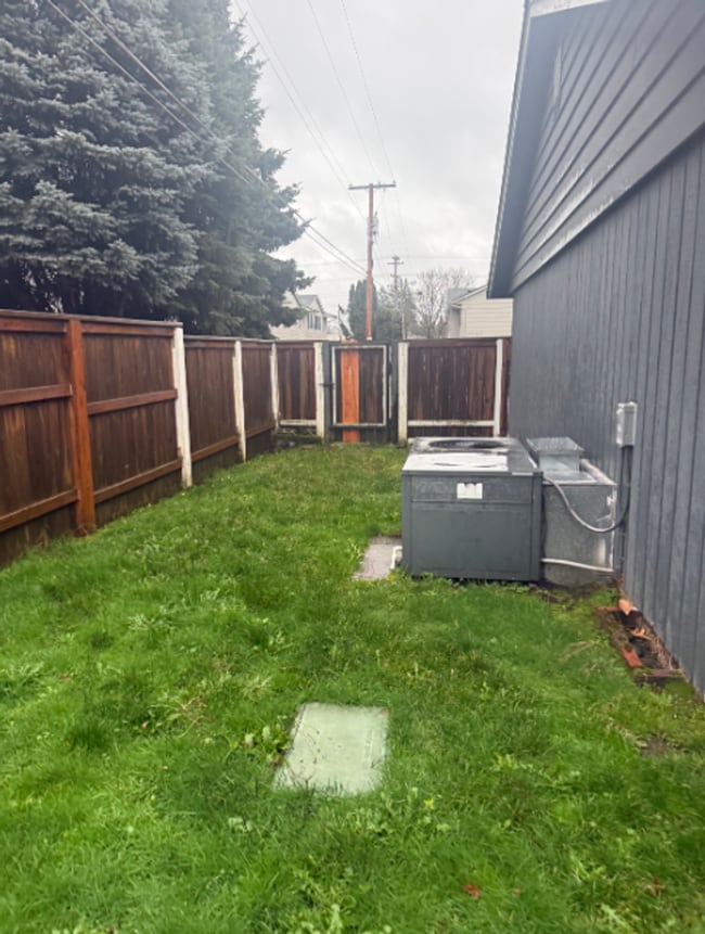 Building Photo - Charming 3 Bedroom with a Living Room, Sun Room,Huge Fenced Yard & More!