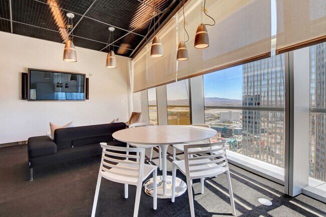 Building Photo - Stunning Strip Views from this Fully Furnished Studio Residence.