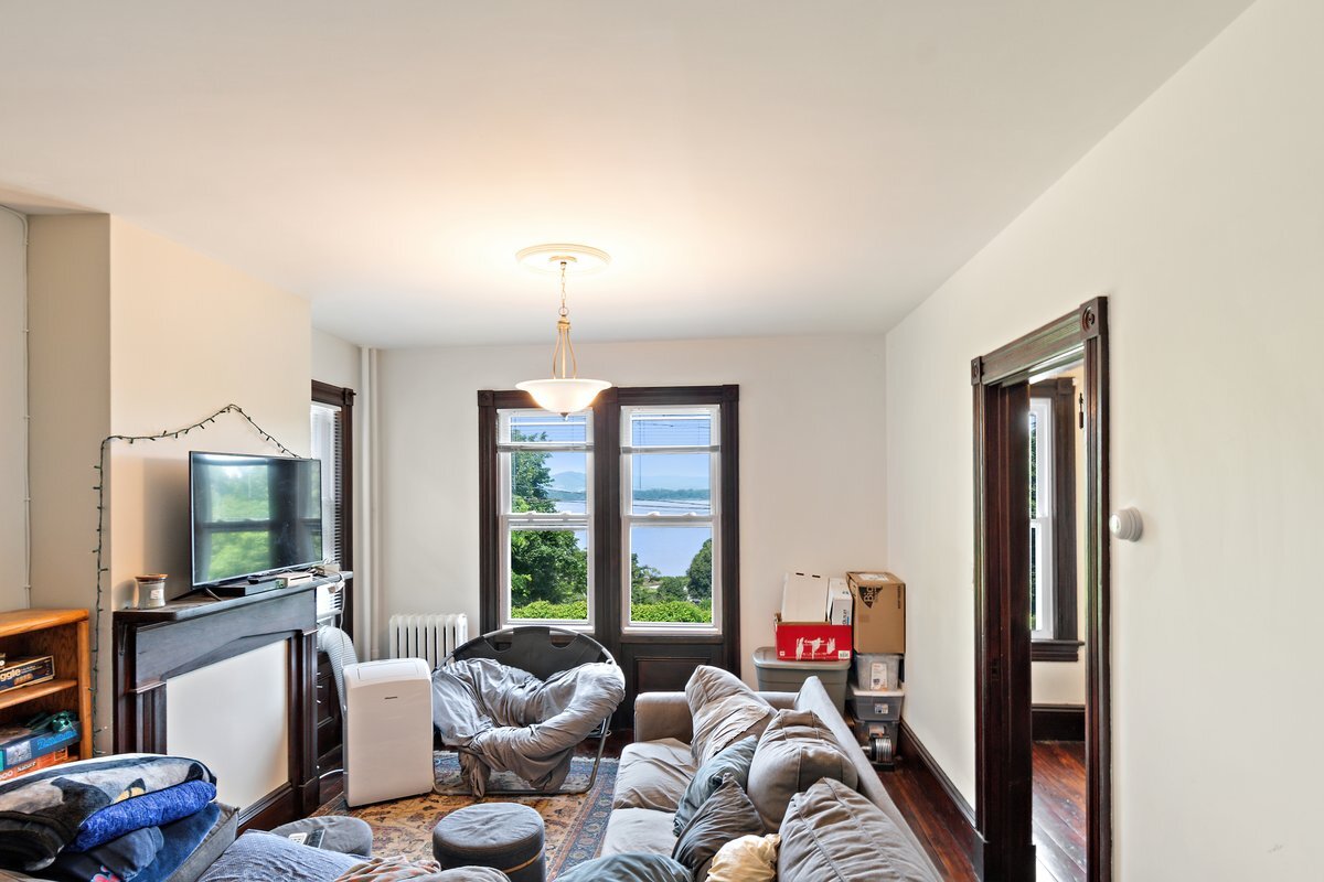 Living room w river view - 3 Independence Pl