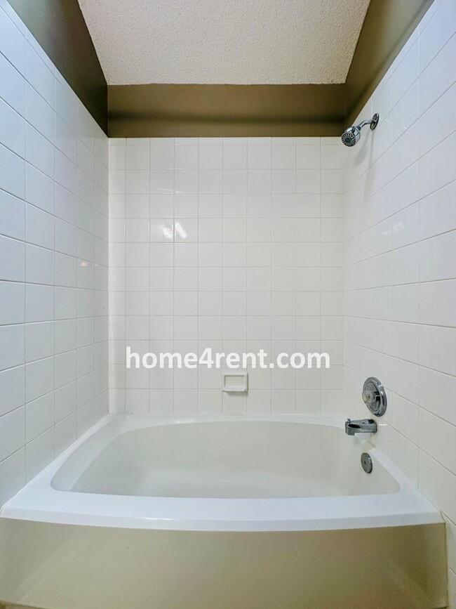 Building Photo - Blue Valley Schools w/ Wood Floors, Finished Basement and a Peaceful, Private Fenced Yard!