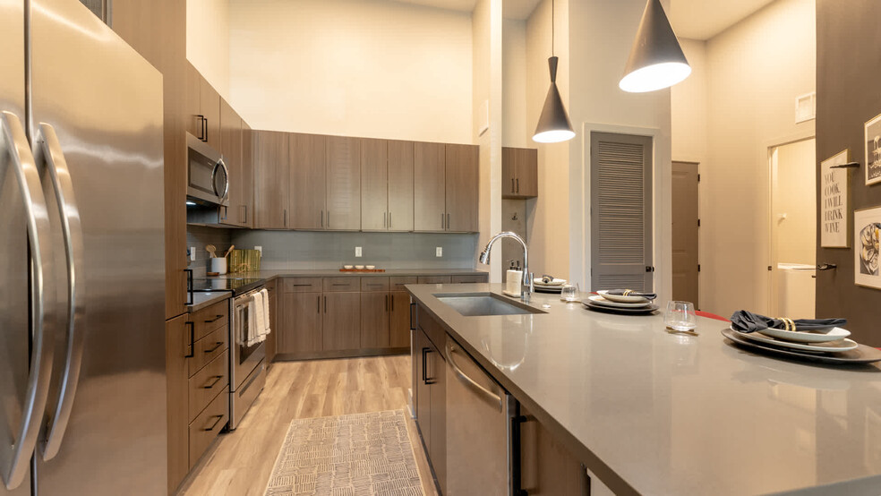 Kitchen with Stainless Steel Appliances and Quartz Countertops - Ayla Stonebriar