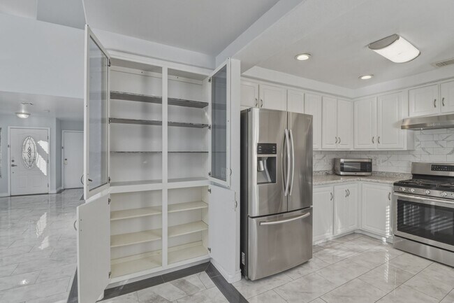 Building Photo - SE!!! 4 Bedrooms!! Master Downstairs!! No Carpet!! Synthetic Grass front and back!!