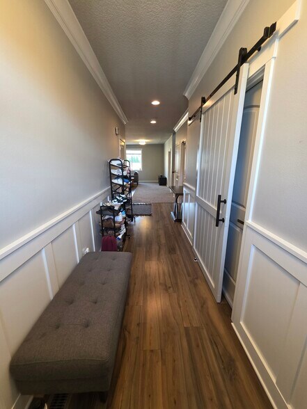 Shared shoe rack in entryway - 10721 NE 109th St