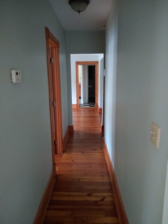 hall view from kitchen - front entrance to the left, bedroom to the right - 20 Phillips St