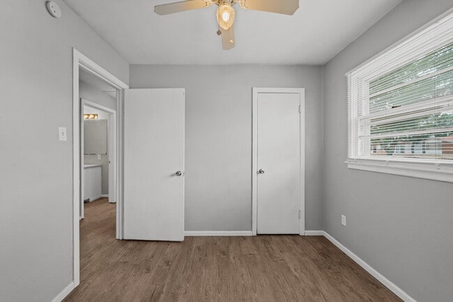 Building Photo - Updated Home with Gorgeous Floors & Large Backyard