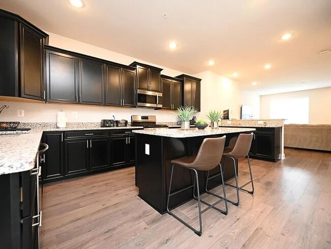 Building Photo - Stunning 3-Story Brick-Front Townhome | Modern Living + Military & First Responder Discount