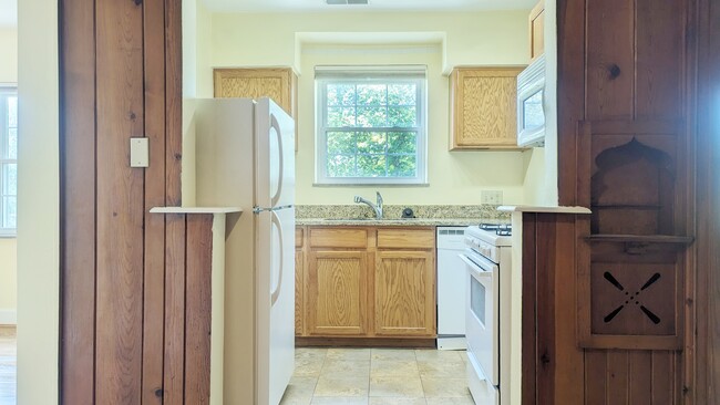 Kitchen with granite countertops. - 2810 Victoria Ave