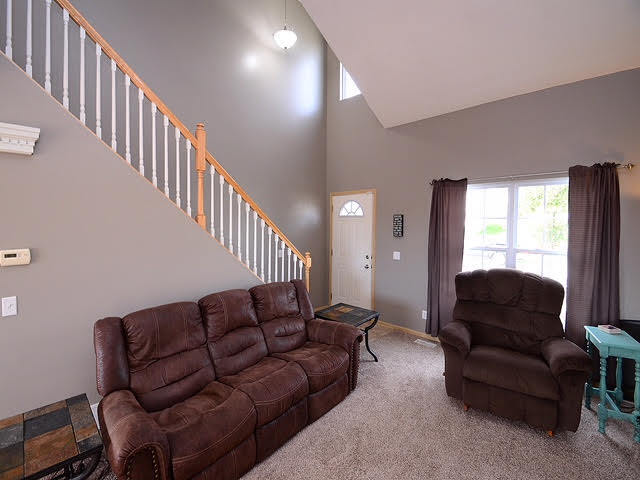 Living room with vaulted ceiling - 6965 N 88th St