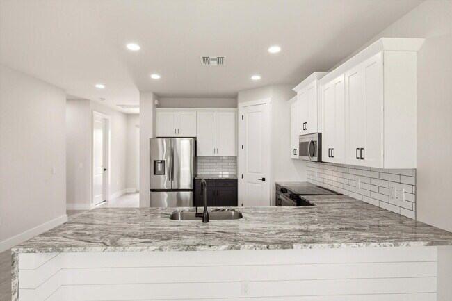 Building Photo - New 3/2 Pool Home for Rent on Canal, Fenced Yard, Pets Welcome. Your Dog Approves of This Backyard