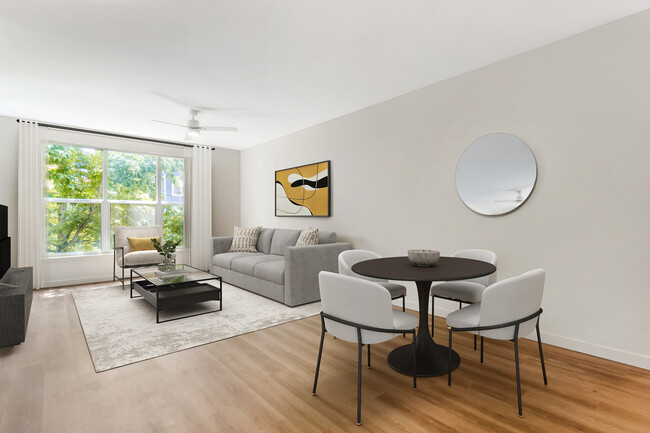 Renovated Package I dining and living room with hard surface flooring (in select homes) - Avalon ParcSquare