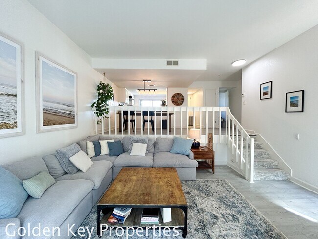 Building Photo - Welcome to this stunning ***unfurnished*** tri-level condo in the desirable Casitas de la Costa c...