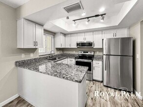 Building Photo - Tree-Lined 2BR/1BA Fort Myers Duplex with Fenced Yard, Storage Shed & In-Unit Laundry!