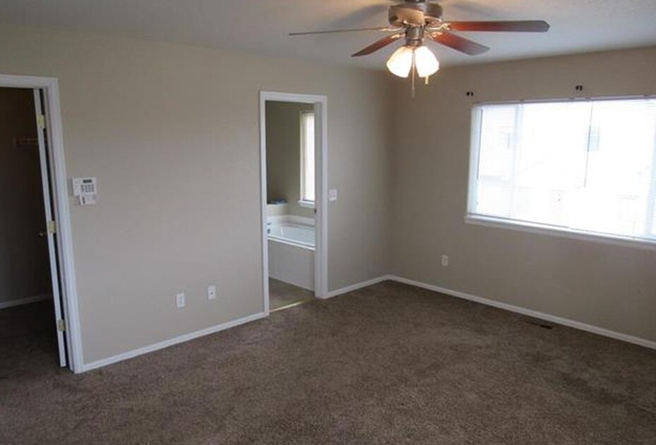 Master bedroom with master bath. - 7334 Pearly Heath Rd