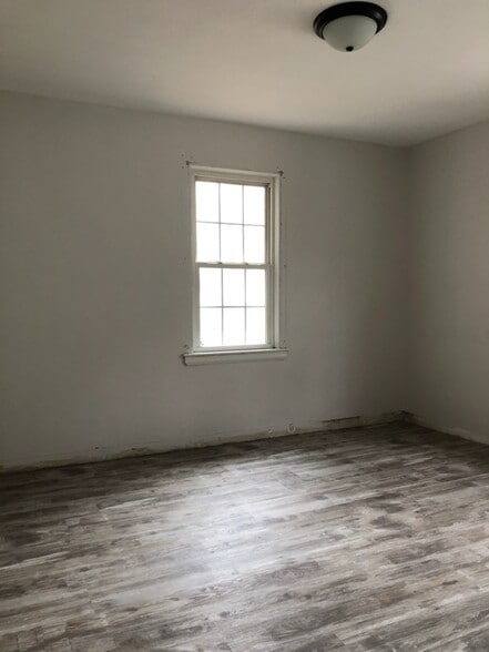 Reno update: Front Bedroom; highlighting floors and layout. What's next? Paint touch ups, new trim, new baseboards, new counter tops, and new doors. - 1395 Ross Ave