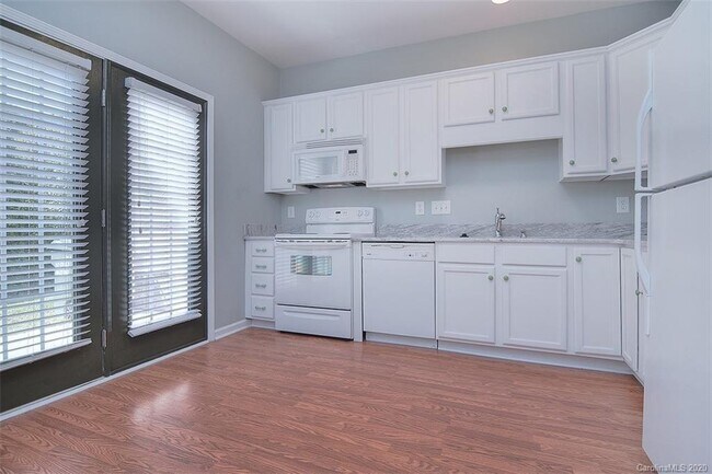 Kitchen with doors to the patio. - 219 Township Dr