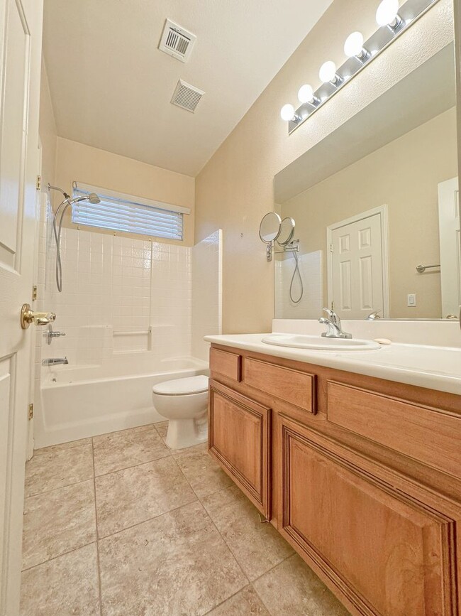 Building Photo - Vaulted Ceiling single-story home in a gat...