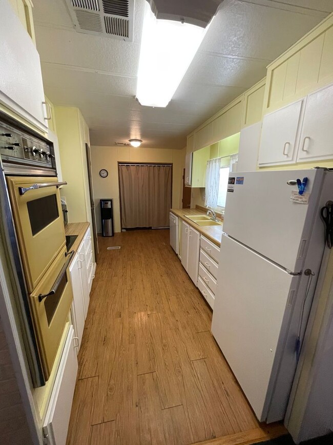 Building Photo - Partially Furnished Manufactured Home on its own Large Corner Lot! *No HOA*